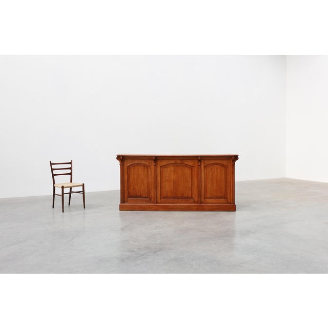 A substantial and highly decorative French shop counter or bar counter, crafted from solid oak and dating to the mid-19th...