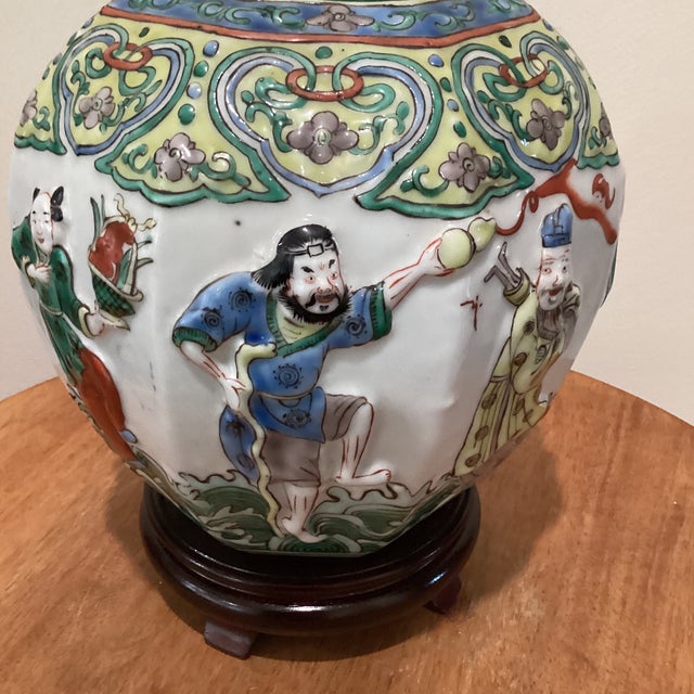 Japanese Antique Chinese Porcelain Ginger Jar With Molded Raised Eight Immortals on Wood Base For Sale - Image 3 of 12