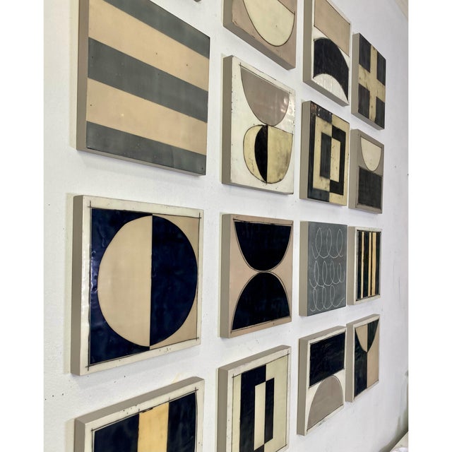 Sixteen 8x8 cradled wood panels make up this encaustic mixed media art piece. In the photo they are hanging spaced...