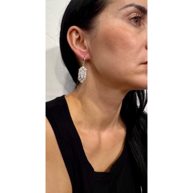 **Vintage 3 Ct Round & Princess Shape Diamond Hanging Earring in Platinum** These exquisite earrings weigh 12 grams and...