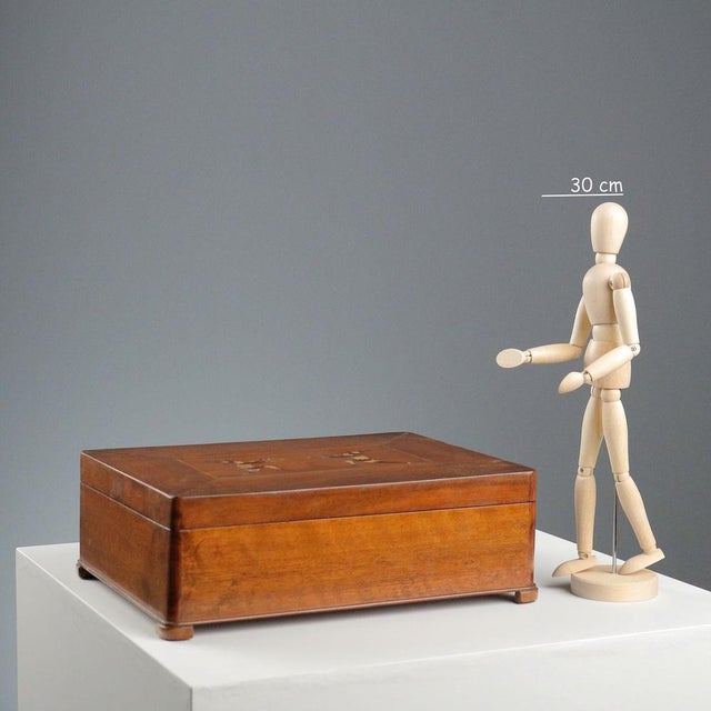 Walnut travel box with internal compartments and a mirror under the lid. Inlaid with various woods depicting jesters,...