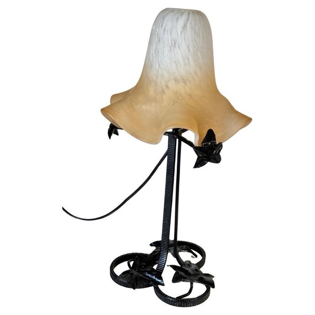 This lamp is a lamp from the Art Deco style. The shade is Art Deco period, the structure may be later. It was made in...