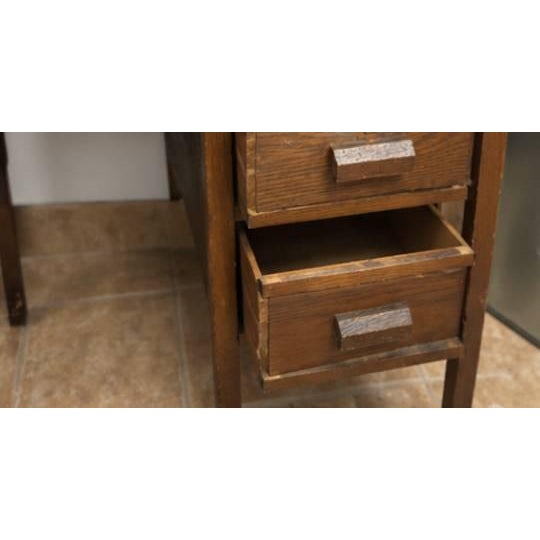 Charming vintage oak roll top desk from the early 20th century (circa 1920s–1940s). Features an original tambour roll top,...