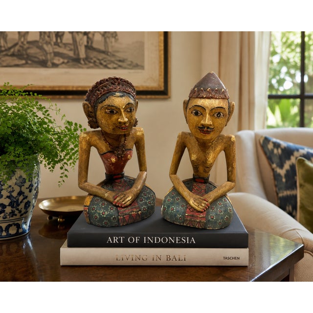 A striking pair of vintage Indonesian Loro Blonyo figures, hand carved from solid wood and beautifully decorated with...