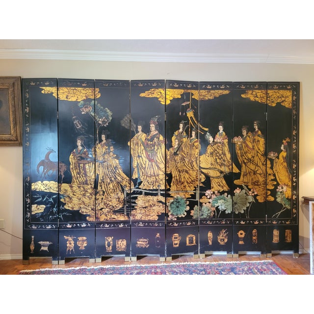 Impressive eight‑panel hand‑painted double view Asian lacquer screen, richly decorated in gold and polychrome pigments...