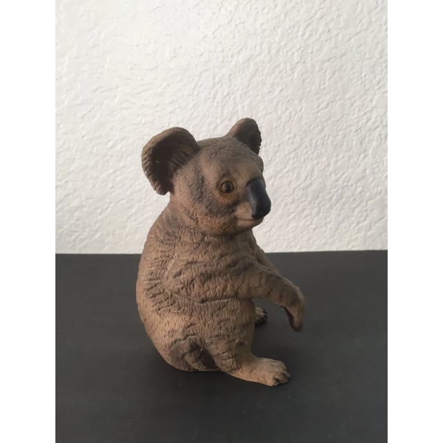 A vintage COR porcelain figurine titled "Resting Koala." Nice condition with slight staining and a few white paint marks....