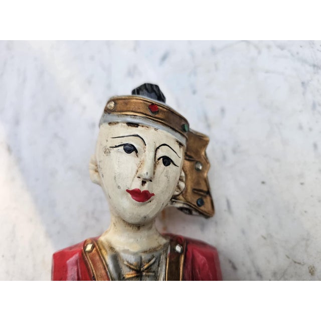 A pre-war wooden carved figure from Burma, a musician, dimensions: height 25 cm, width 10.4 cm, depth 8 cm.