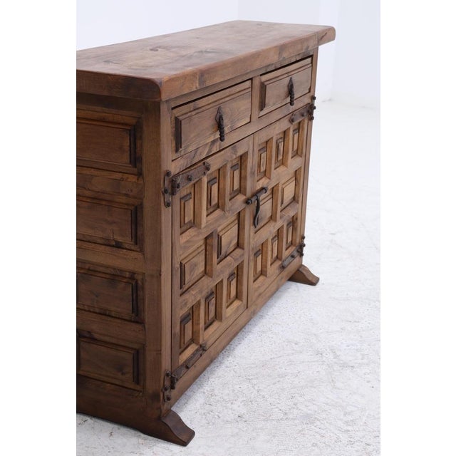 Beautiful mid-century chest of drawers from the 1960s • Made of walnut wood • Two drawers in the upper section • Two doors...
