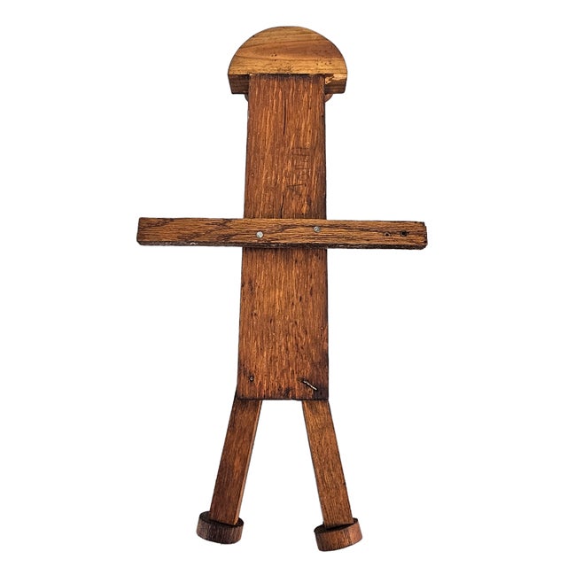 This vintage wall-mounted figure represents American folk-art construction using plank elements, hardware fasteners, and a...