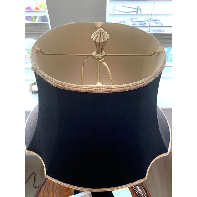 Eclectic Porcelain elephant lamp from Italy. Features black linen shade with gold trim and light tan lining. Listed height...