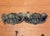 Set of six antique stamped brass bail pulls, four complete and two missing bails,. Pulls feature a striking figural face...