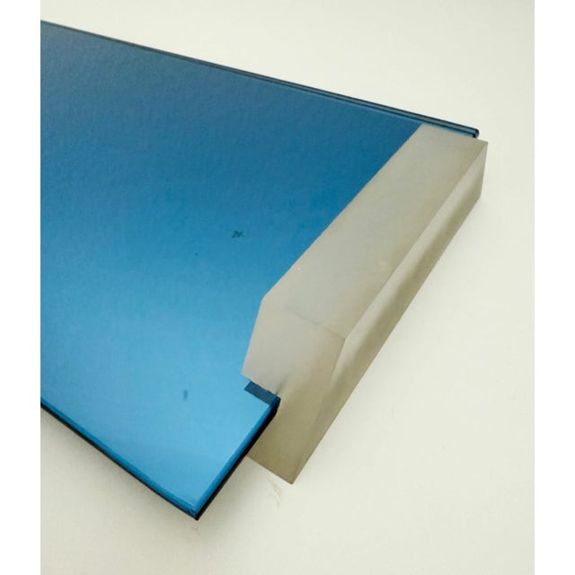 A rare vintage 1930s Art Deco era blue mirror and lucite vanity tray. It features a striking cobalt blue mirrored glass...
