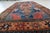 A charming vintage German rug dating from the 1950s, featuring a bold tribal-inspired geometric design and a rich, vibrant...