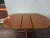 This is a apartment size pedestal oval dining table teak made by G-plan E Gomme company 1970. The leaf pops up and table...