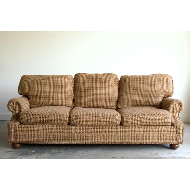 A substantial English roll arm sofa made in the USA by Lexington, custom-upholstered by the previous estate in a Ralph...