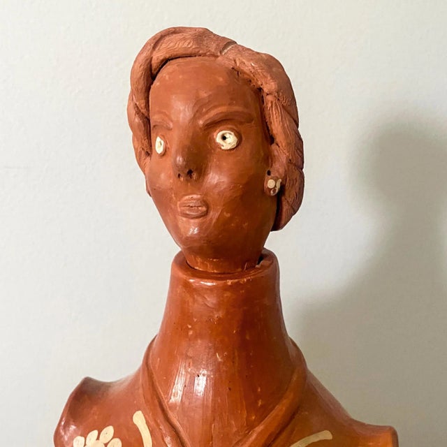 This vintage terracotta woman sculpture was handmade and handpainted in northern Brazil, purchased in the early 1980s....