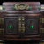 Ornate multi‑compartment Chinese rosewood vanity jewelry box, richly carved with dragon‑phoenix motifs and auspicious...