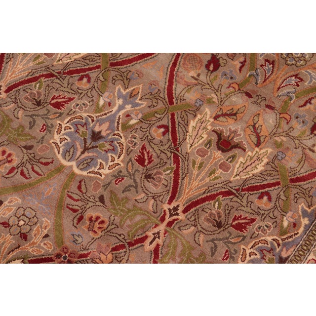Designed with mesmerizing intricacy and gorgeous color palette, this hand-knotted masterpiece demonstrates the beauty and...