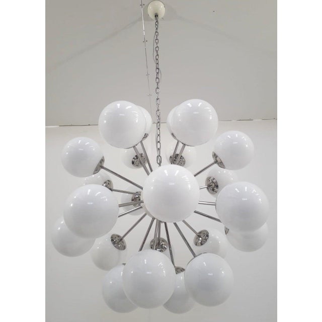 Italian sputnik chandelier with 24 glossy white Murano glass globes mounted on polished nickel finish frame / Made in...