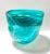 A substantial hand-blown art glass vessel featuring vivid turquoise and aqua swirls suspended throughout thick clear...