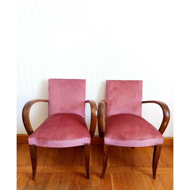 Pair of bridge chairs, known as "moustache" chairs, Art Deco style, circa 1940/1950. Wooden frame with armrests, seats and...