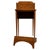 An elegant early 20th-century English cabinet, finely crafted from satinwood and distinguished by its delicate ebony...