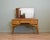 A mid-century walnut dressing table by Alfred Cox, dating from the 1960s. Standing on elegant tapered legs and beautifully...