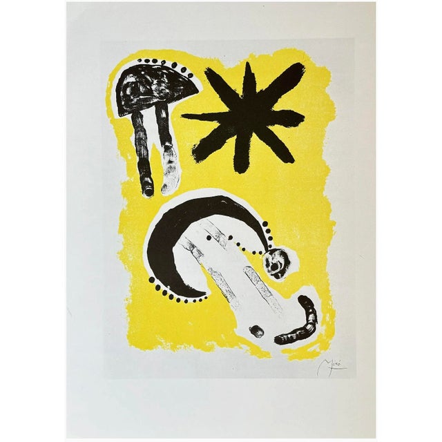 Striking vintage lithographic image after Joan Miró (Spanish, 1893–1983), featuring a vibrant yellow field with bold black...