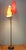 A very attractive German mid-century floor lamp with yellow and red paper shades, showing slight signs of wear. The two...