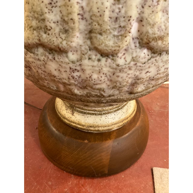 Swanky mid century walnut and ceramic floor lamp in the style of Jane and Gordon Martz, with useful built in table. Table...