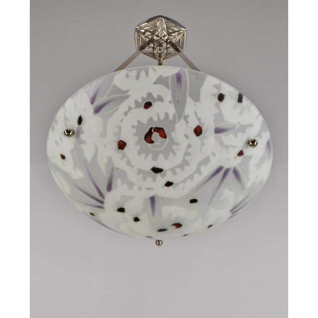 MAXONADE A beautiful French 1930 art deco chandelier in nickel plated solid brass or bronze holding a cloisonné enameled...
