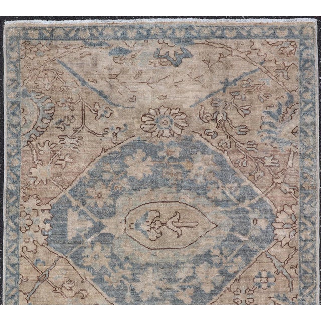 Measures: 3'1 x 5'2 This Afghanistan Tabriz rug features a refined soft ivory field highlighted by an elegant pale blue...
