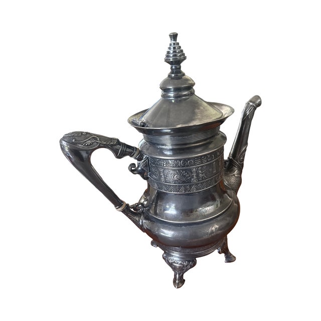 An extraordinary Victorian Egyptian Revival quadruple-plated coffee pot by Derby Silver Company of Connecticut, dating...