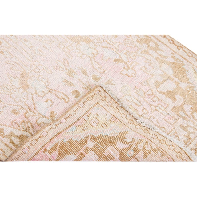 Beautiful vintage Persian Hamadan hand-knotted shabby chic wool runner with a beige field. This rug has a beige frame with...