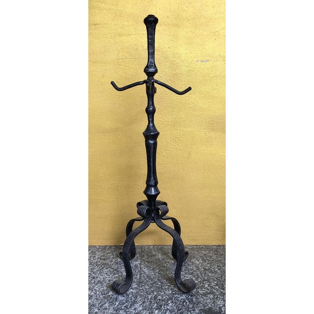 This exquisite fireplace set dates from the 1940s and impresses with its handcrafted quality made of robust wrought iron....