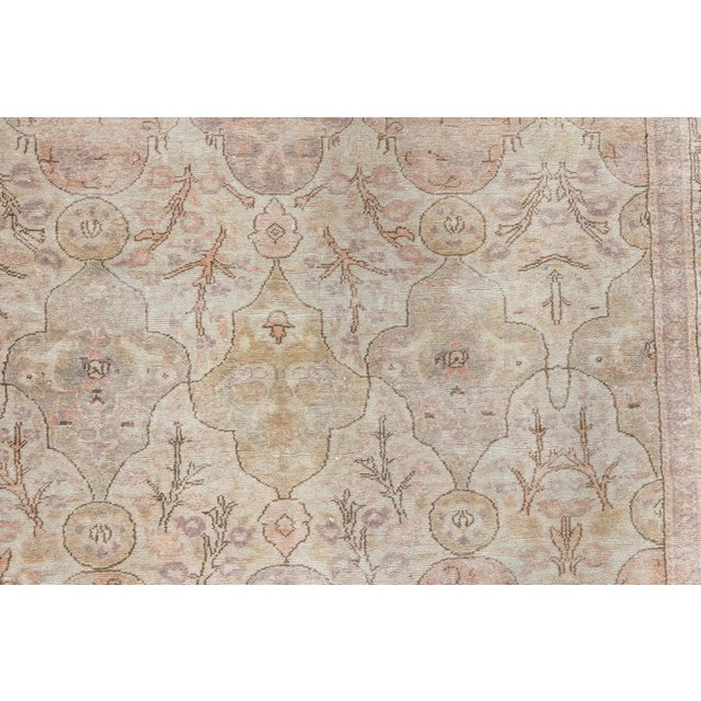 Exemplifying the height of Ottoman weaving artistry, this antique Hereke rug embodies the grace and refinement for which...