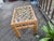 This 1950's era vintage-style rattan and glass end table features a distinctive lattice pattern top and sturdy bamboo...