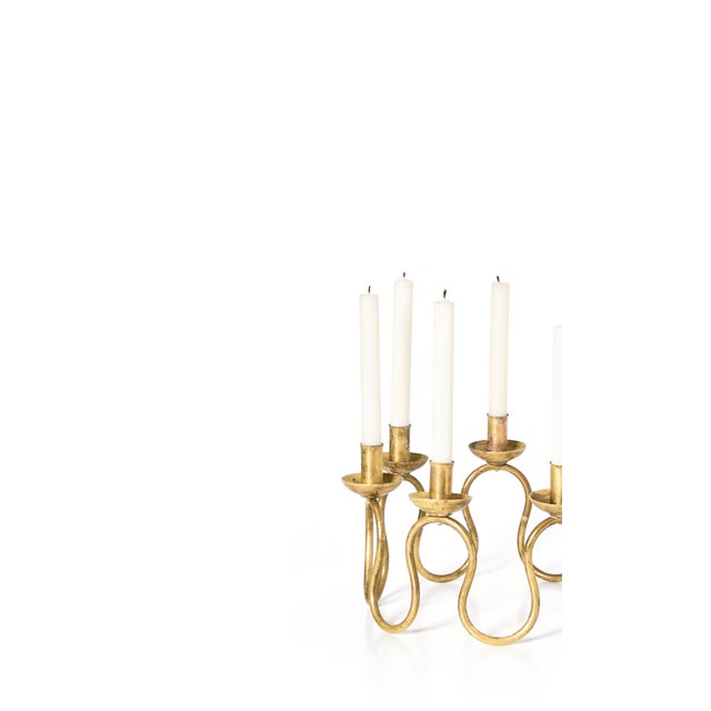 Midcentury brass candlestick designed by Lars Holmström. Produced by Lars Holmström in Arvika, Sweden. Wonderfully...