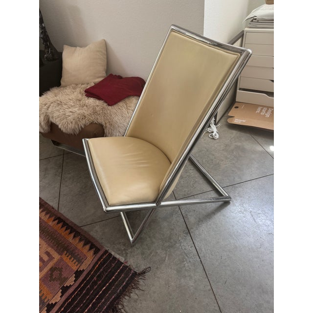Designed by Ward Bennett in 1964, this authentic 2006 production Scissor Chair features its original almond leather...