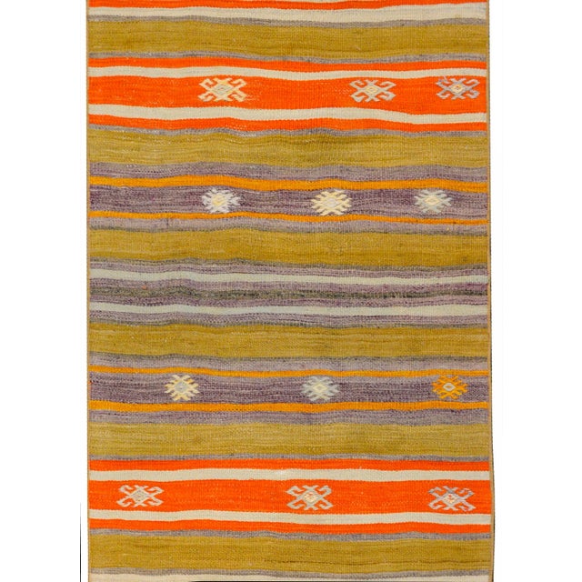 A gorgeous early 20th century Turkish Konya Kilim runner with a wonderful striped pattern woven in beautiful greens,...