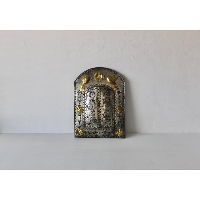 Hand-tooled Mexican tin mirror embodies the spirit of traditional folk craftsmanship found throughout Central and Northern...