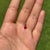 This dainty solitaire pendant features a 0.69 carat natural ruby set in 14K yellow gold. The ruby measuring 4.8 mm,...