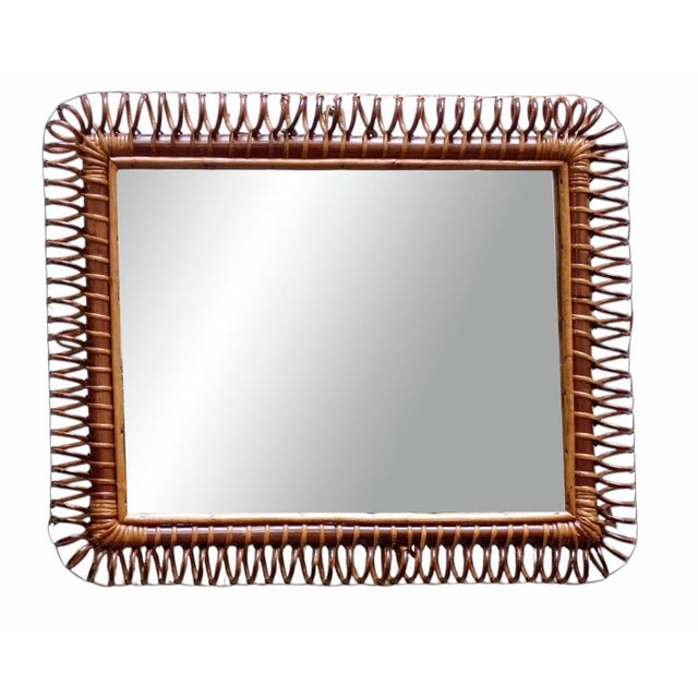 Spectacular rectangular mirror handcrafted from curved bamboo and rattan and wicker. It has a rectangular shape enriched...