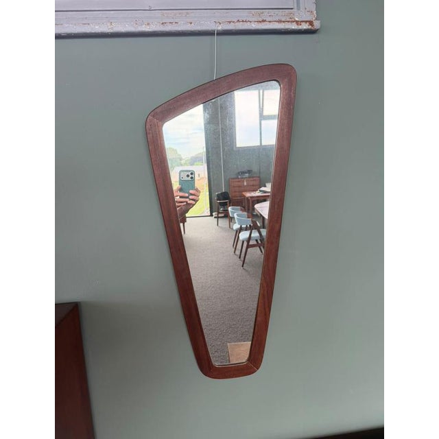 Danish organic-shaped teak mirror, 1960 it is not geometry that defines this mirror, but its irregular form. The profile...