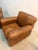 Classic and comfortable, this pair of Mitchell Gold tan leather club chairs is upholstered in rich, warm caramel leather...