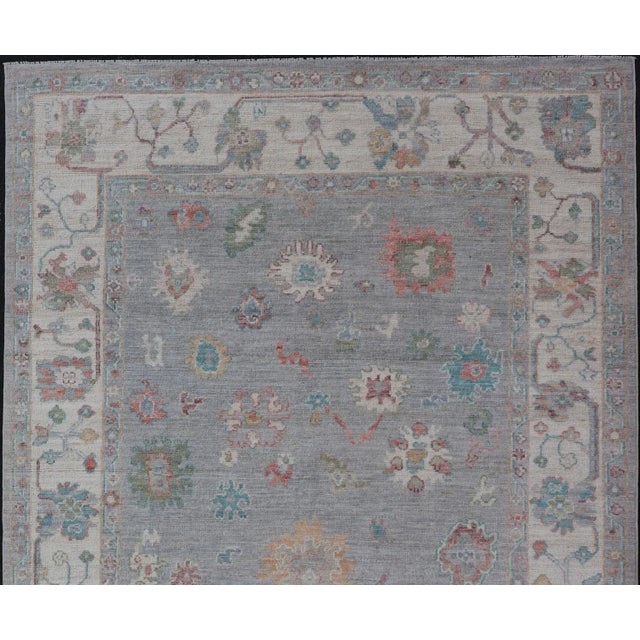Measures: 5'8 x 9'0 Hand Knotted Floral Modern Oushak With a Gray Background And Multi-Colors. Keivan Woven Arts; rug...