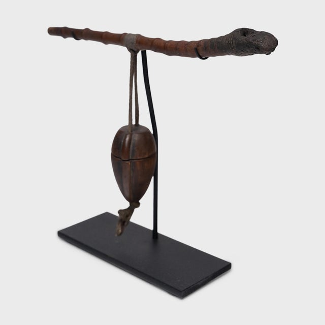 This curious keepsake from the late 19th century is a provincial Chinese smoking pipe and its accompanying tobacco pouch....