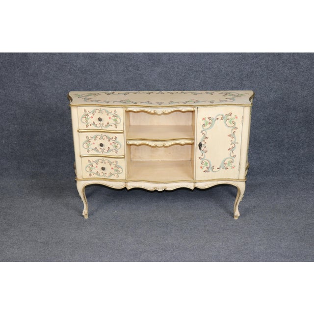 Dimensions: 30.5 inches high x 45.75 inches wide x 13.25 inches deep An exceptionally charming and highly decorative...