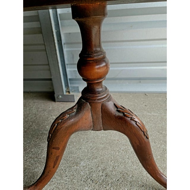Beautifully carved tiered table. Well maintained and cared for in the same family.