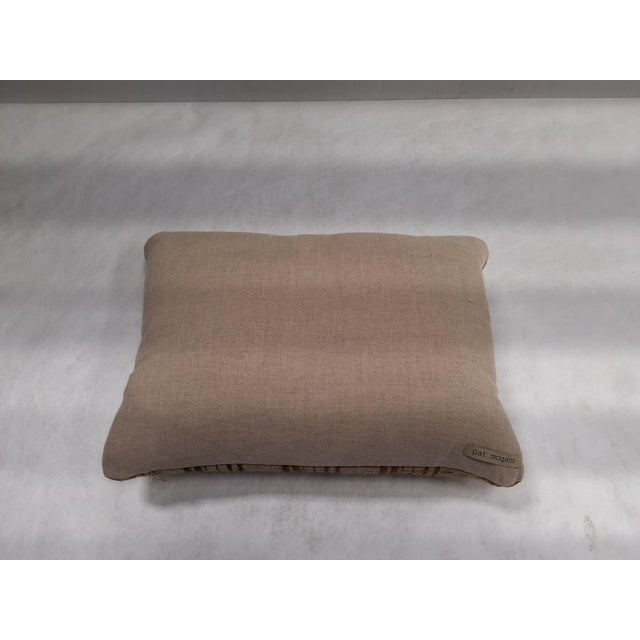 Pat McGann throw pillow made with handwoven textile fabric from Neeru Kumar in Piano Keys Olive Fabric materials are raw...